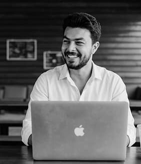 Hamza Rizvi working at a laptop
