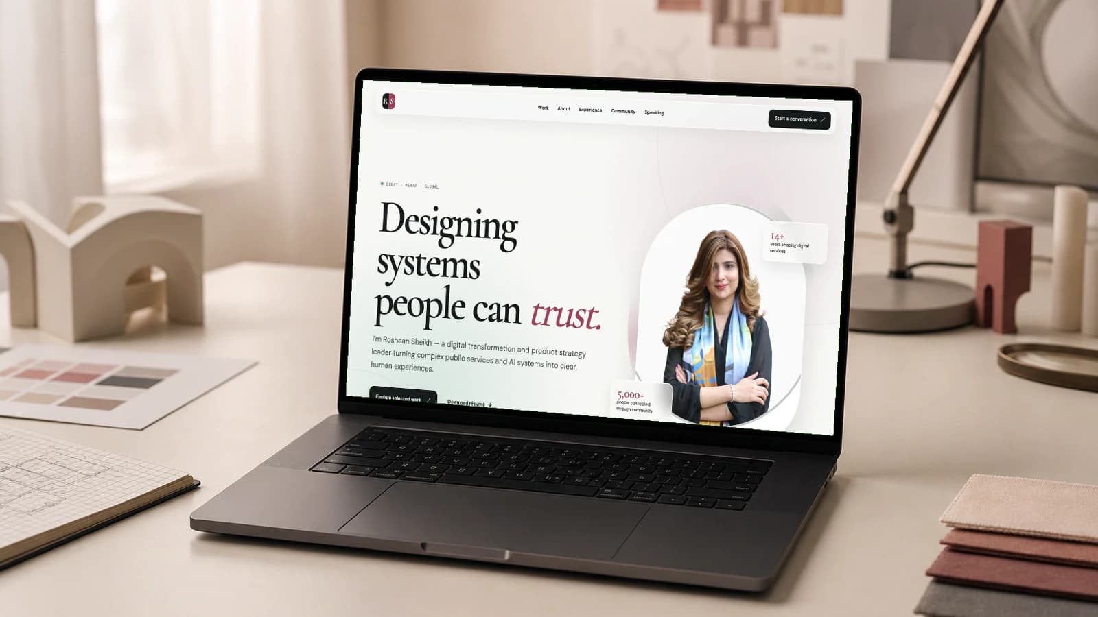 Roshaan Sheikh website shown on a laptop mockup